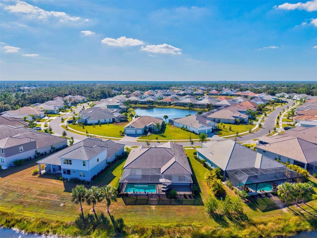 12436 Destin Loop Venice, FL 34293 - Photo 59 of 85 an aerial view of residential houses with outdoor space