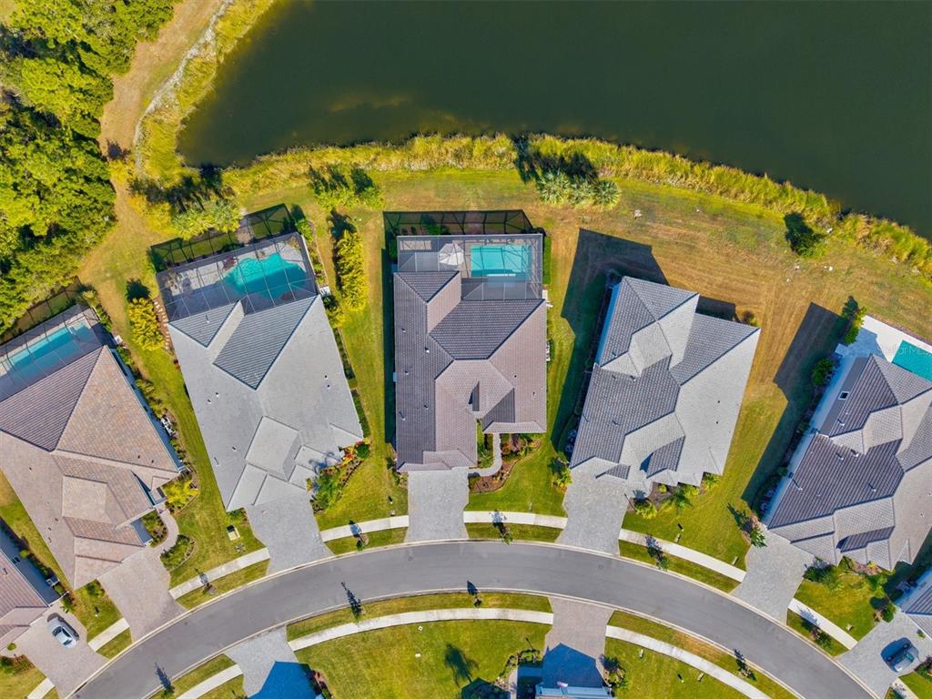 12436 Destin Loop Venice, FL 34293 - Photo 62 of 85 an aerial view of houses with swimming pool