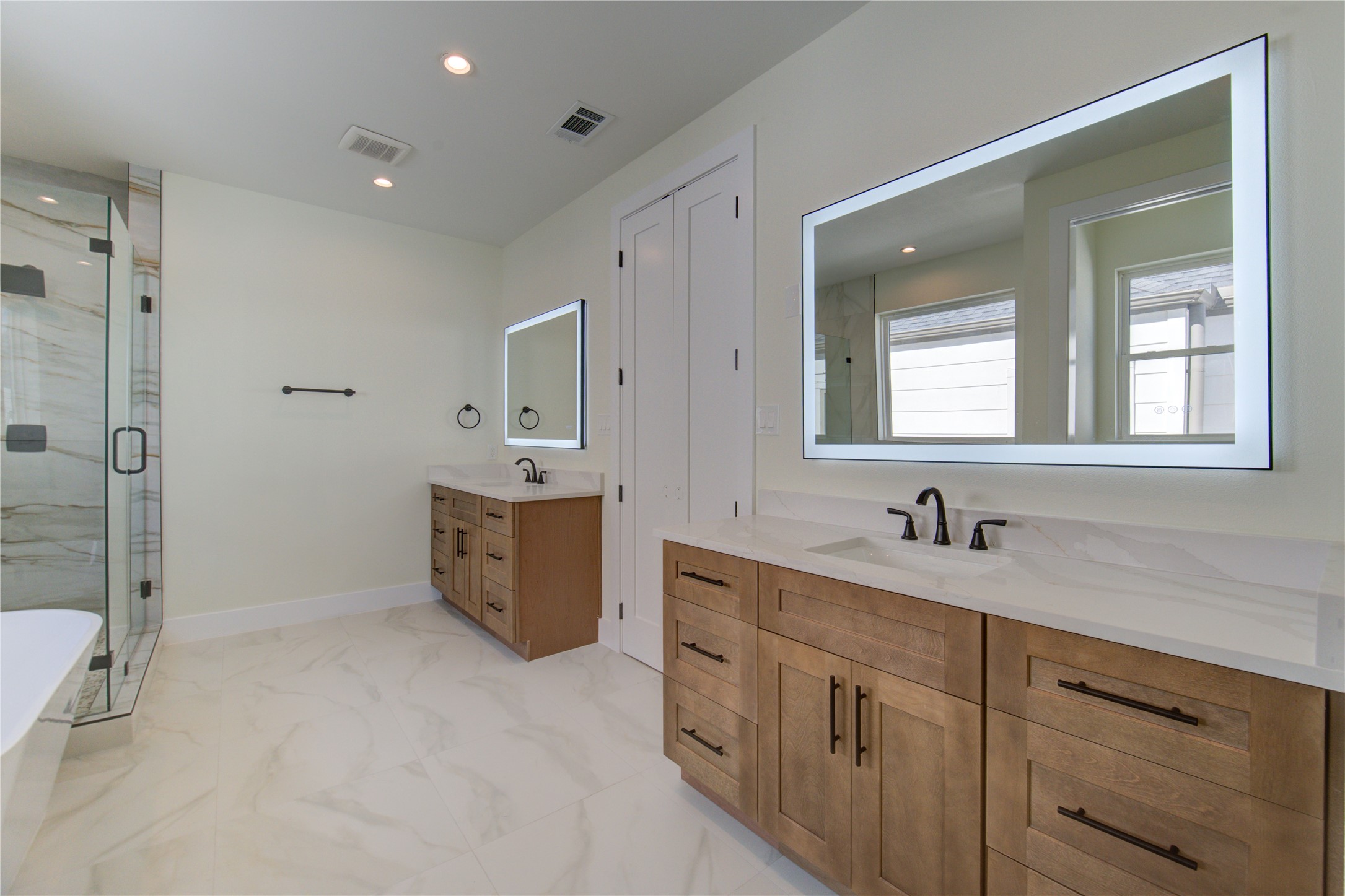 1810 Hazard Street, Unit A Houston, TX 77019 - Photo 14 of 47 a bathroom with a double vanity sink mirror and shower