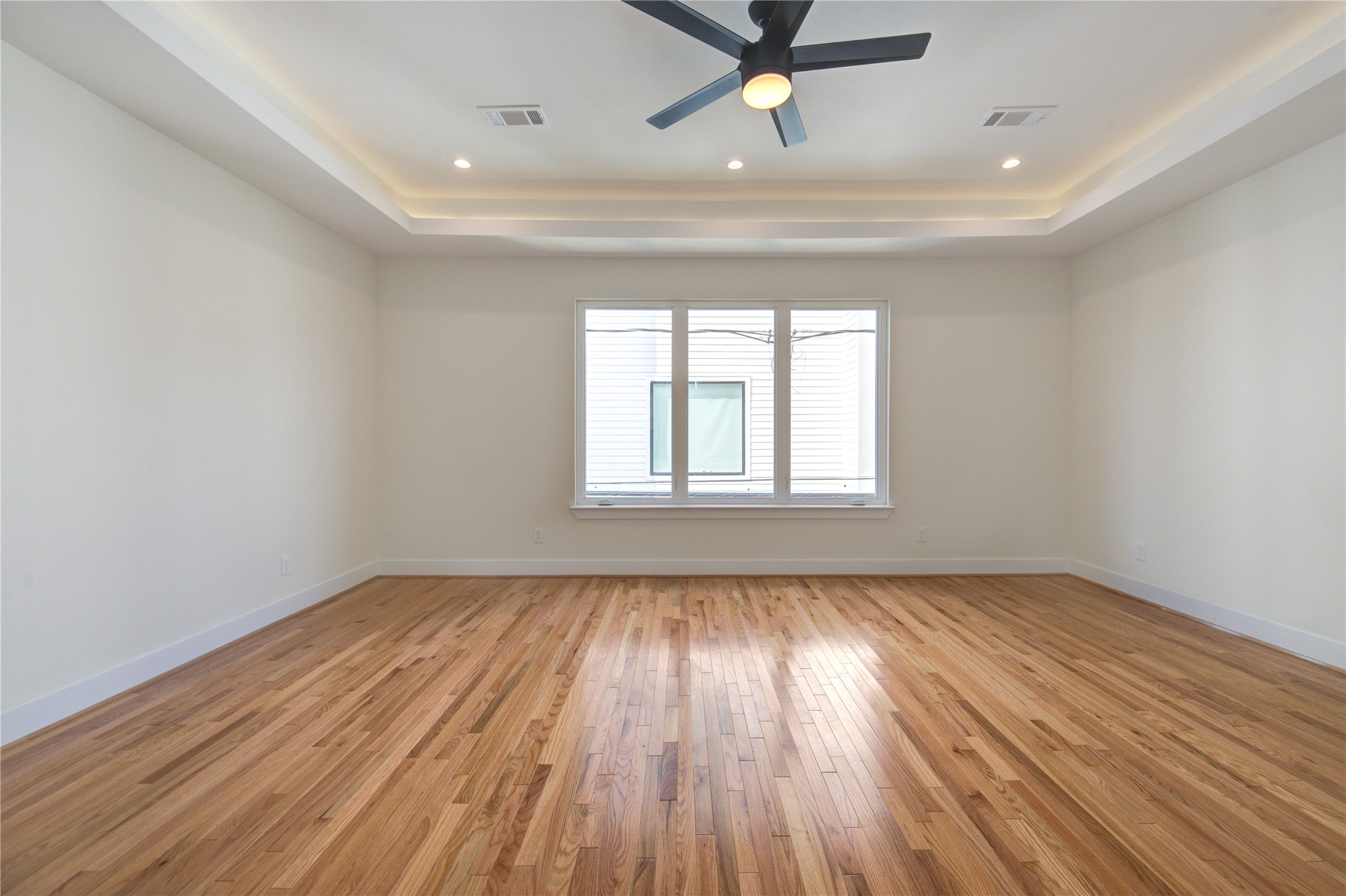 1810 Hazard Street, Unit A Houston, TX 77019 - Photo 18 of 47 a view of empty room with wooden floor and fan