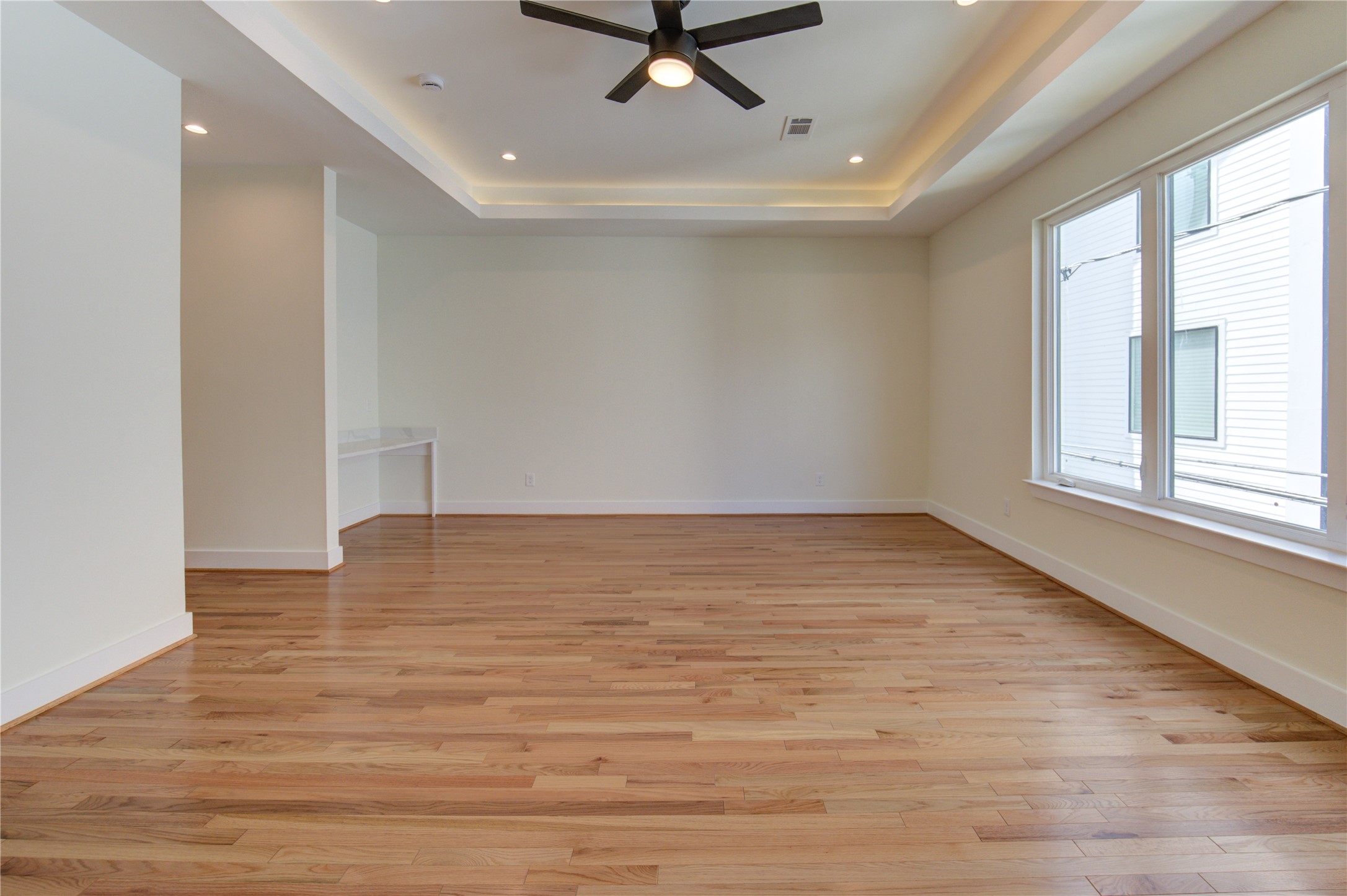 1810 Hazard Street, Unit A Houston, TX 77019 - Photo 19 of 47 wooden floor in an empty room with a window