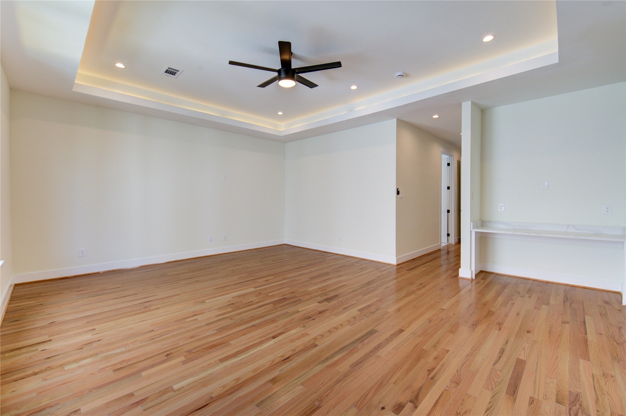 1810 Hazard Street, Unit A Houston, TX 77019 - Photo 22 of 47 a view of a livingroom with a hardwood floor and a ceiling fan
