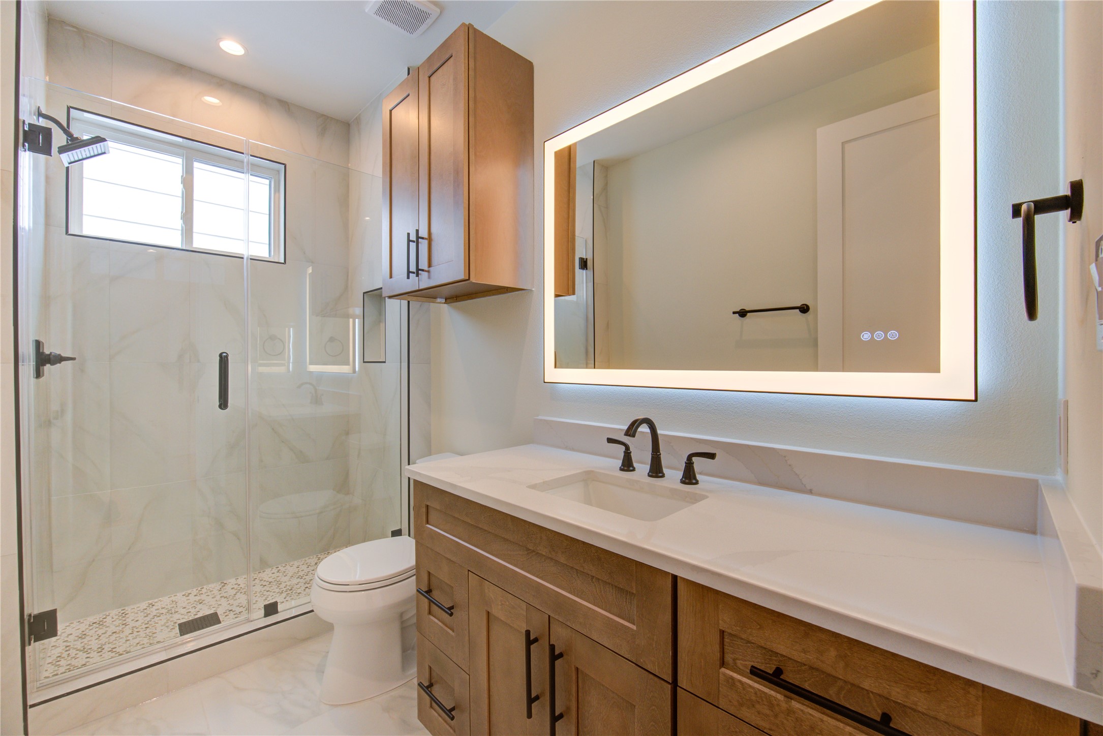 1810 Hazard Street, Unit A Houston, TX 77019 - Photo 25 of 47 a bathroom with a sink a toilet and shower