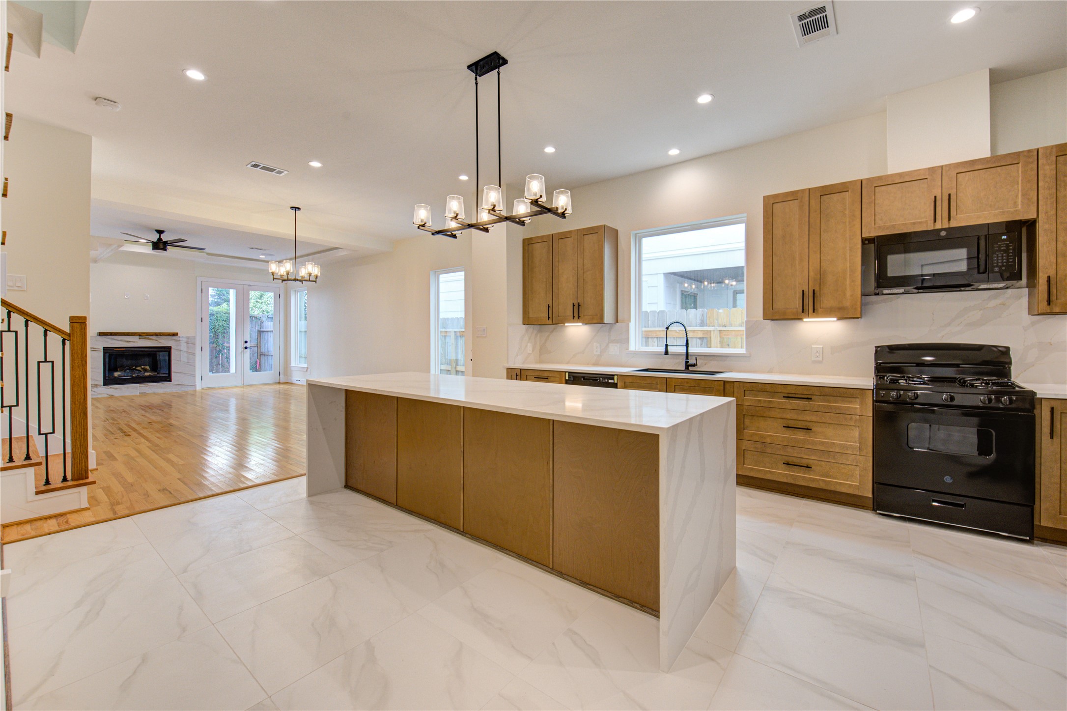 1810 Hazard Street, Unit A Houston, TX 77019 - Photo 33 of 47 a large kitchen with granite countertop a large counter top stainless steel appliances and cabinets