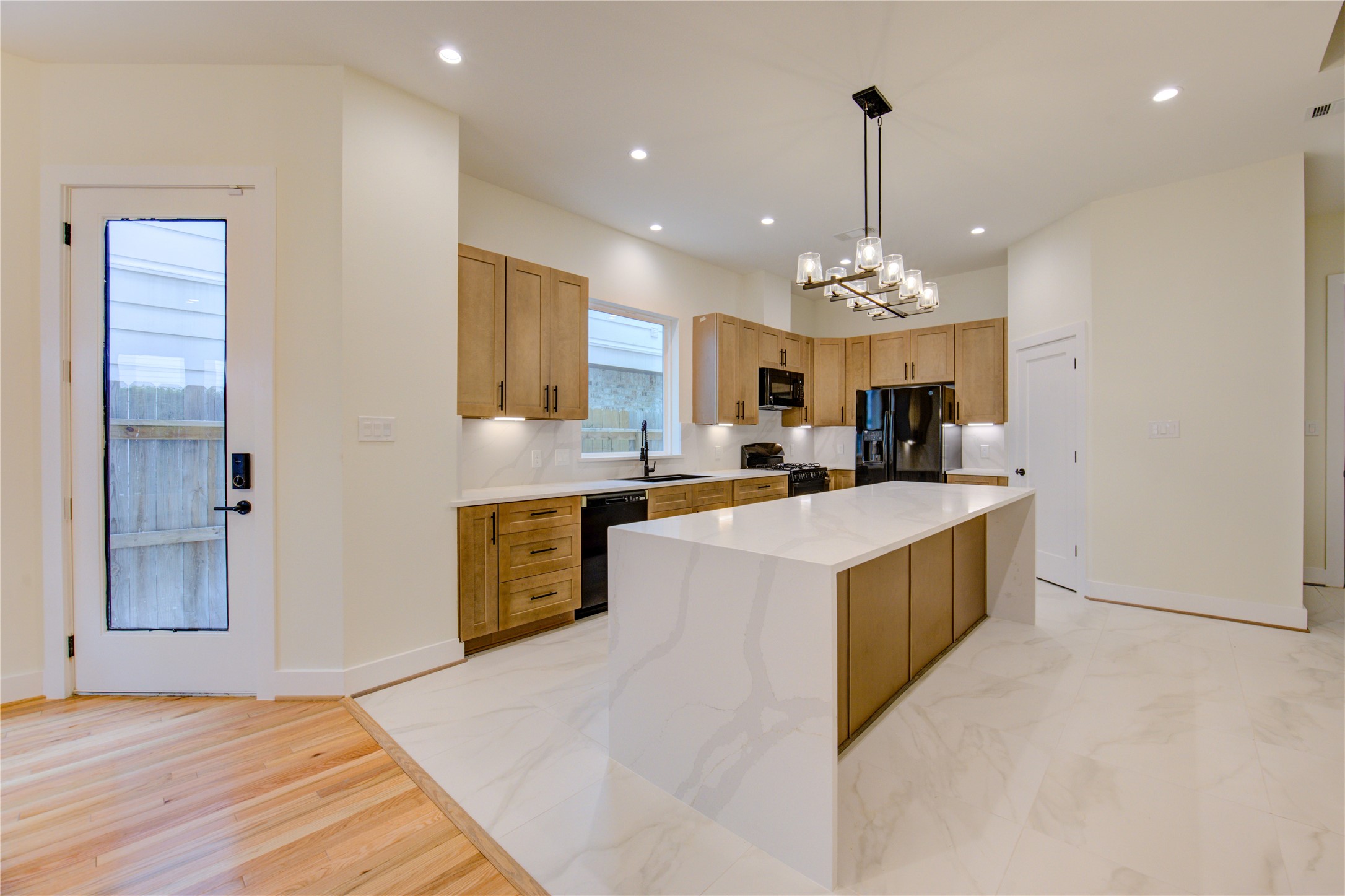 1810 Hazard Street, Unit A Houston, TX 77019 - Photo 41 of 47 a kitchen with stainless steel appliances granite countertop a sink stove and refrigerator
