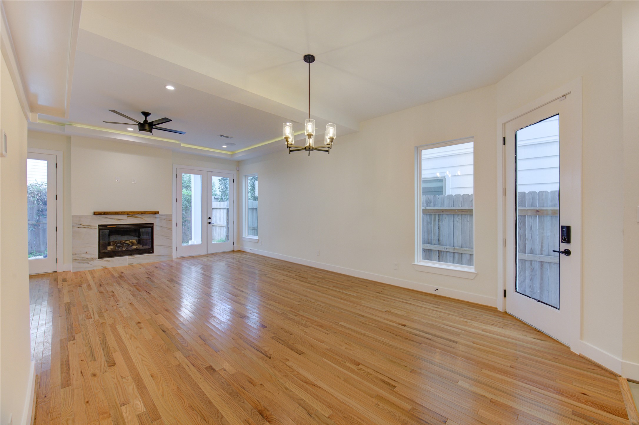 1810 Hazard Street, Unit A Houston, TX 77019 - Photo 5 of 47 a view of a livingroom with wooden floor and a fireplace
