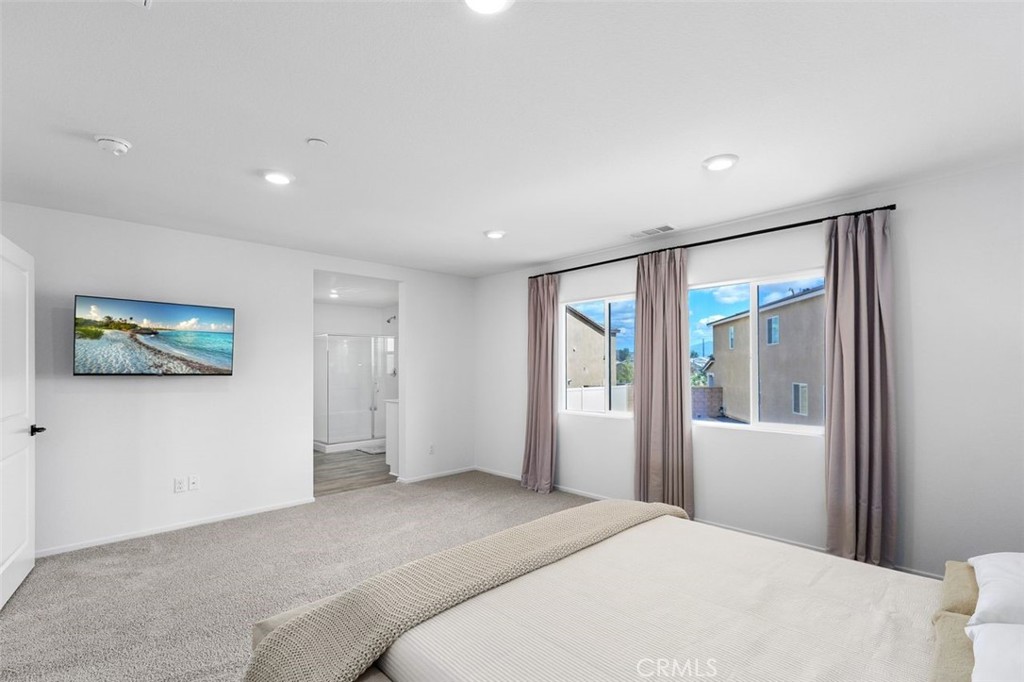 28876 Camaro Drive Winchester, CA 92596 - Photo 17 of 44 a bedroom with a bed and a painting on the wall