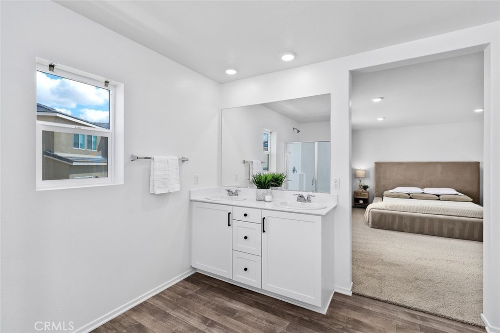28876 Camaro Drive Winchester, CA 92596 - Photo 20 of 44 a living room with white cabinets and wooden floor