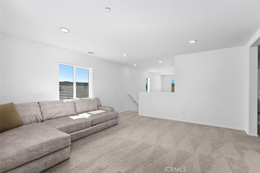 28876 Camaro Drive Winchester, CA 92596 - Photo 23 of 44 a living room with furniture and a couch
