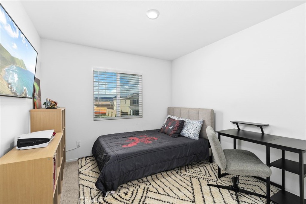 28876 Camaro Drive Winchester, CA 92596 - Photo 26 of 44 a bedroom with a bed and a window