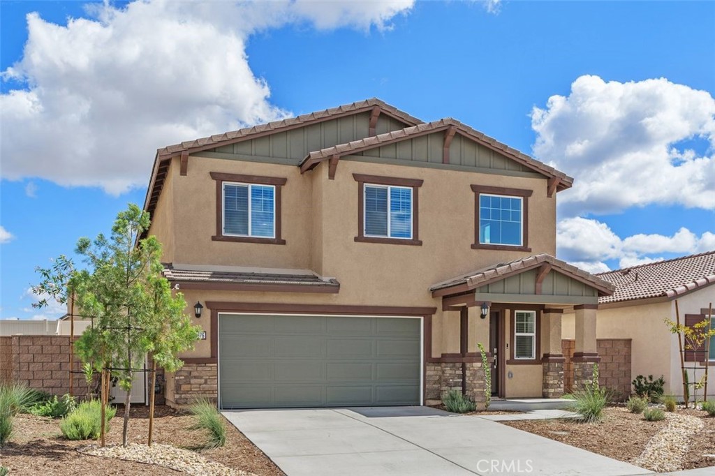 28876 Camaro Drive Winchester, CA 92596 - Photo 3 of 44 a front view of a house with a yard
