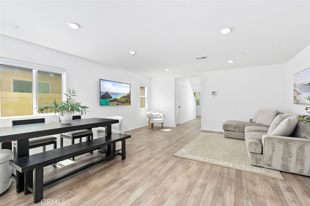 28876 Camaro Drive Winchester, CA 92596 - Photo 6 of 44 a living room with furniture and a flat screen tv