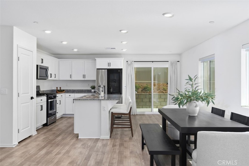 28876 Camaro Drive Winchester, CA 92596 - Photo 9 of 44 a kitchen with a table and chairs in it