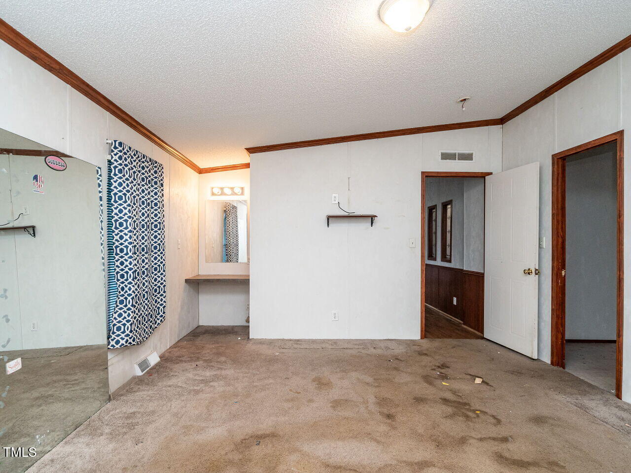 9140 Ransdell Road Raleigh, NC 27603 - Photo 16 of 26 a view of a big room with closet and windows