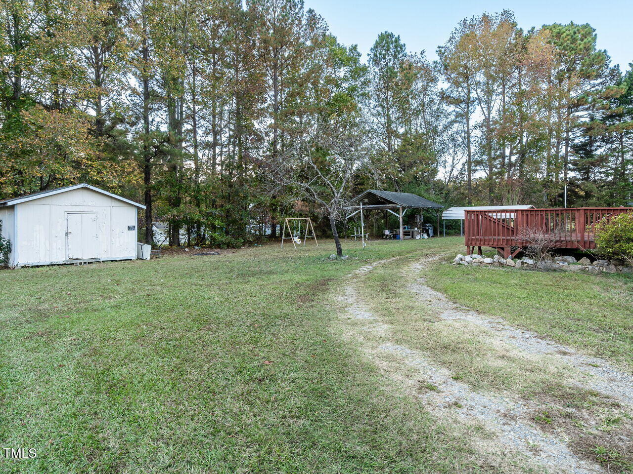 9140 Ransdell Road Raleigh, NC 27603 - Photo 25 of 26 a view of a backyard with a garden and trees