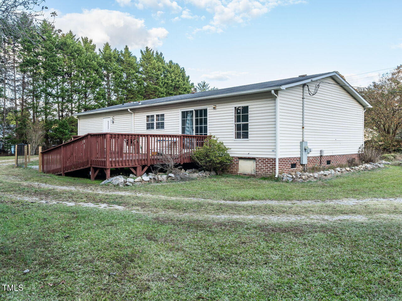 9140 Ransdell Road Raleigh, NC 27603 - Photo 26 of 26 a view of a house with a yard and a garden