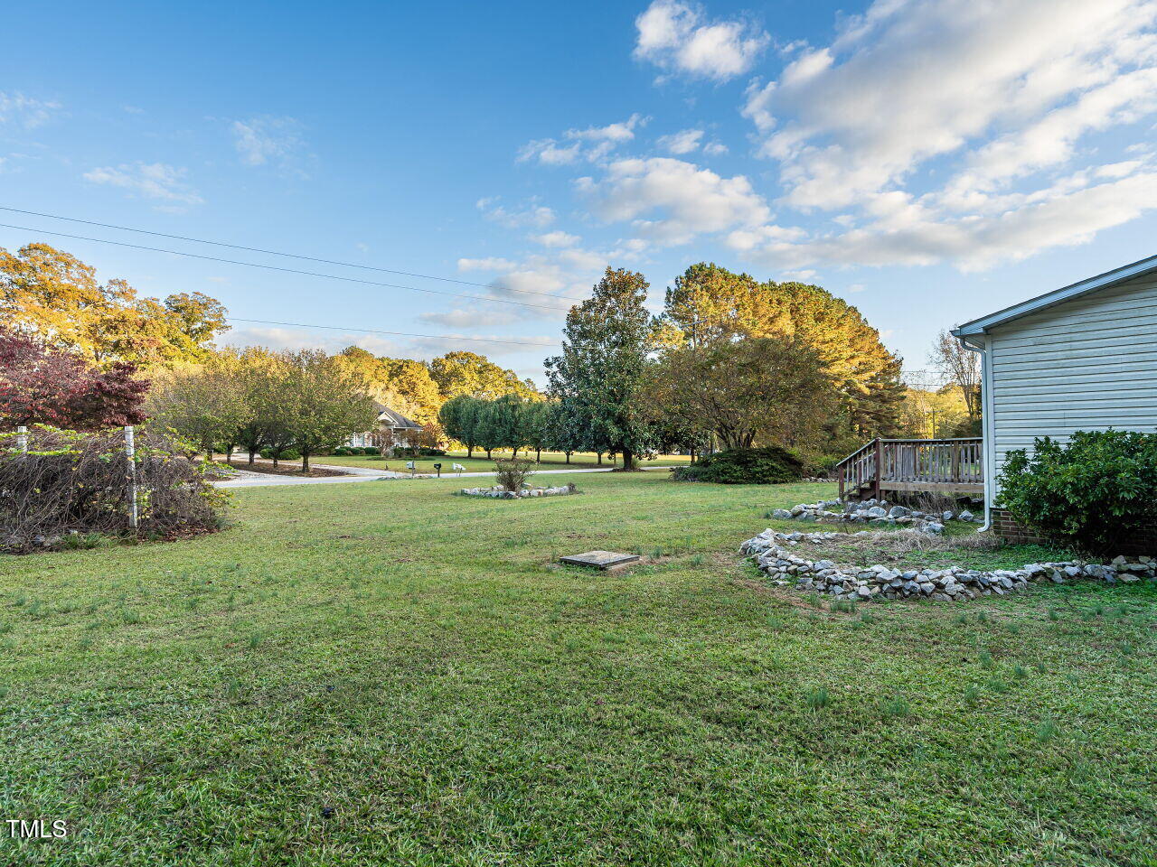 9140 Ransdell Road Raleigh, NC 27603 - Photo 4 of 26 a view of a house with a big yard