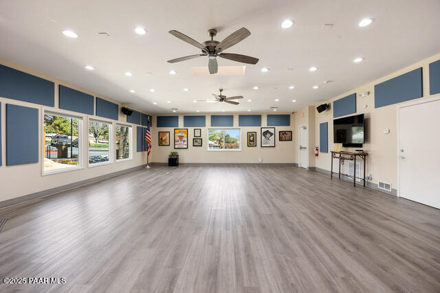 4600 Prairie Trail Prescott, AZ 86301 - Photo 15 of 19 a view of an empty room with wooden floor and a ceiling fan