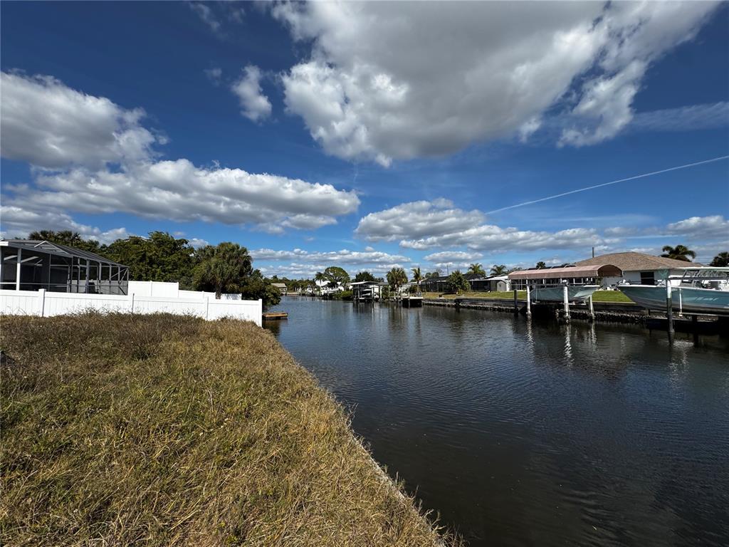 4366 Wynkoop Circle Port Charlotte, FL 33948 - Photo 6 of 8 a view of a lake with houses