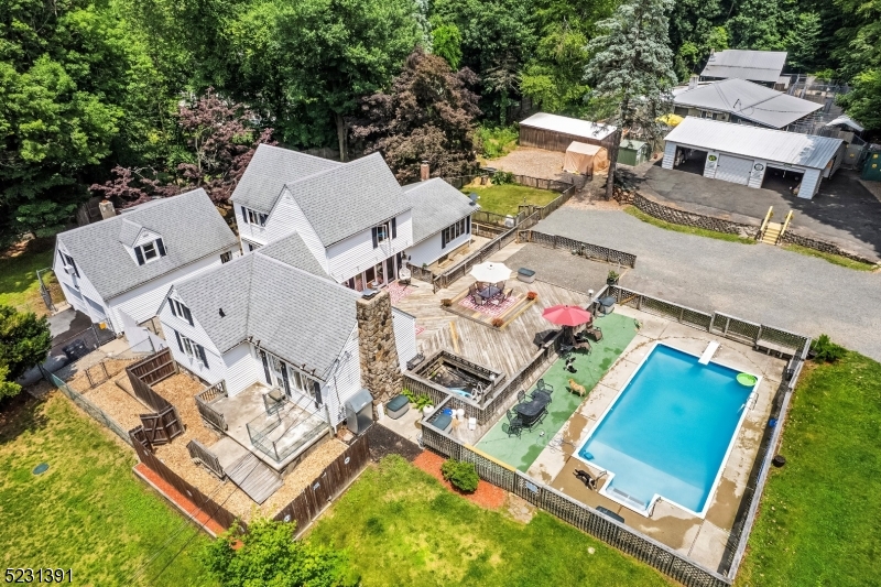 an aerial view of residential house with pool