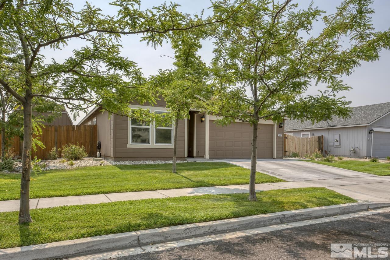 8950 Yeager Street Reno, NV 89506 - Photo 2 of 40 a view of a house with a yard and tree s