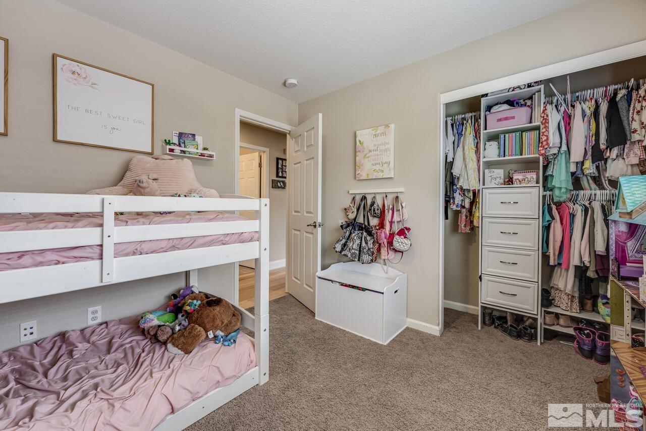 8950 Yeager Street Reno, NV 89506 - Photo 29 of 40 a bed room with a bed and a walk in closet