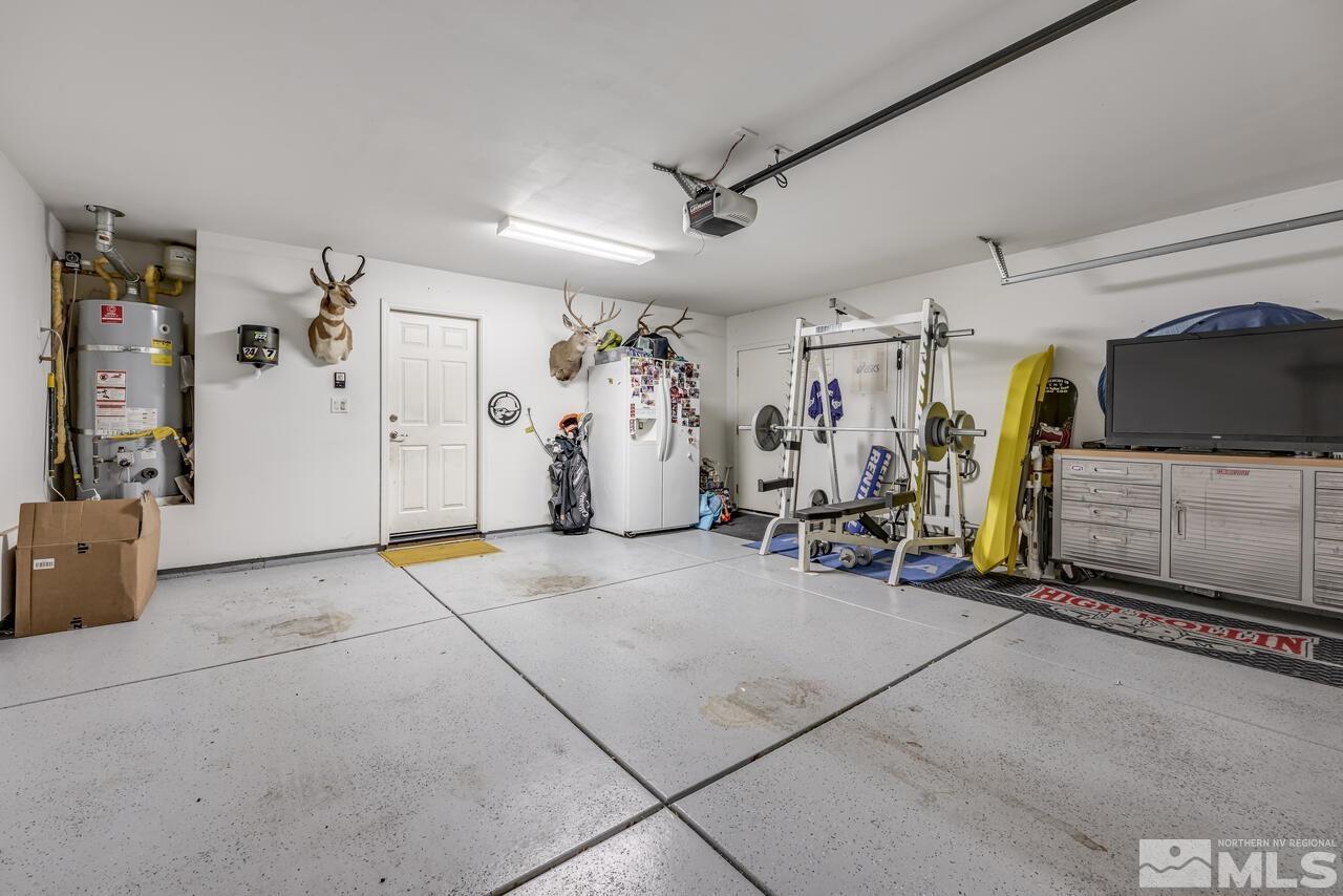 8950 Yeager Street Reno, NV 89506 - Photo 31 of 40 a view of a garage with rack and bicycle