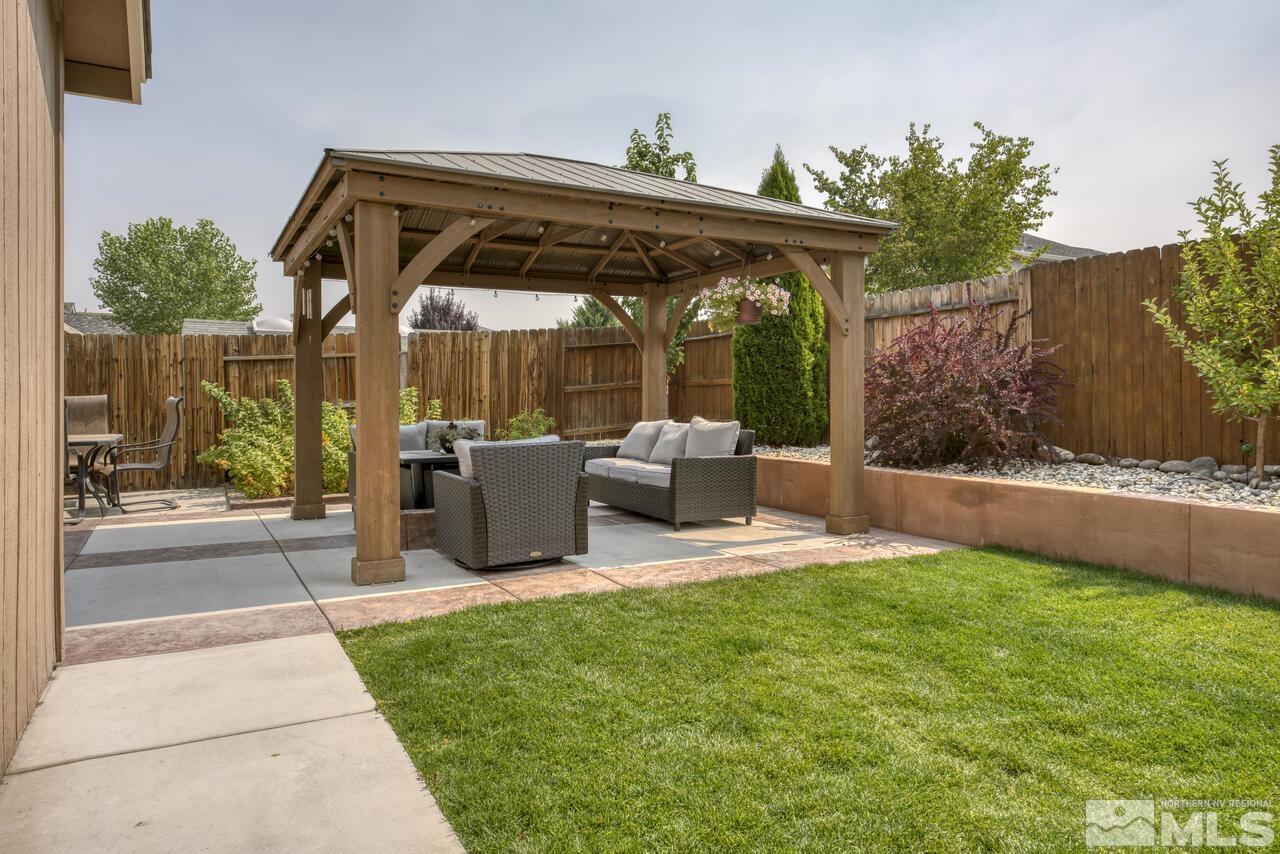 8950 Yeager Street Reno, NV 89506 - Photo 40 of 40 a view of a patio with table and chairs and potted plants