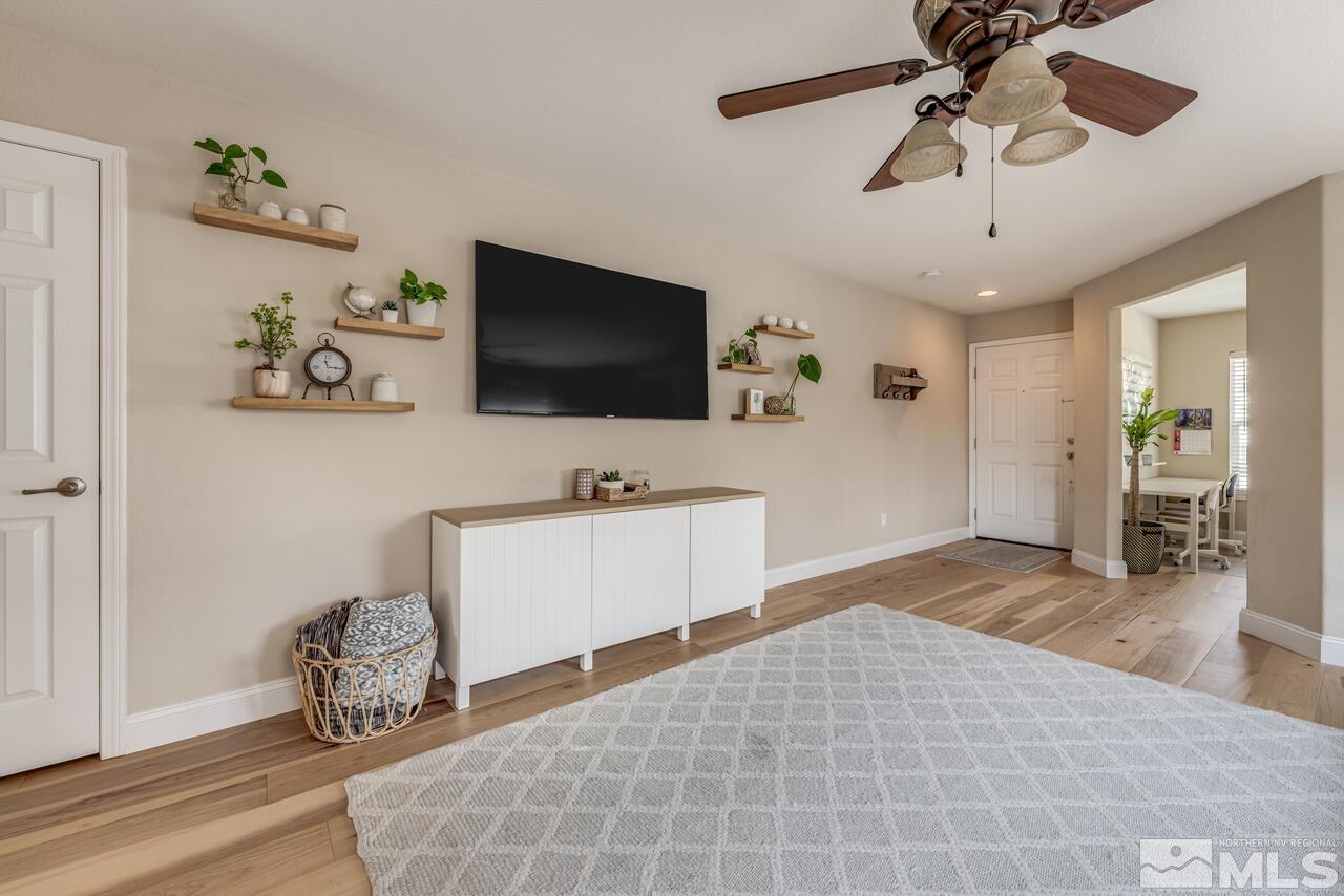 8950 Yeager Street Reno, NV 89506 - Photo 9 of 40 a living room with furniture and a flat screen tv