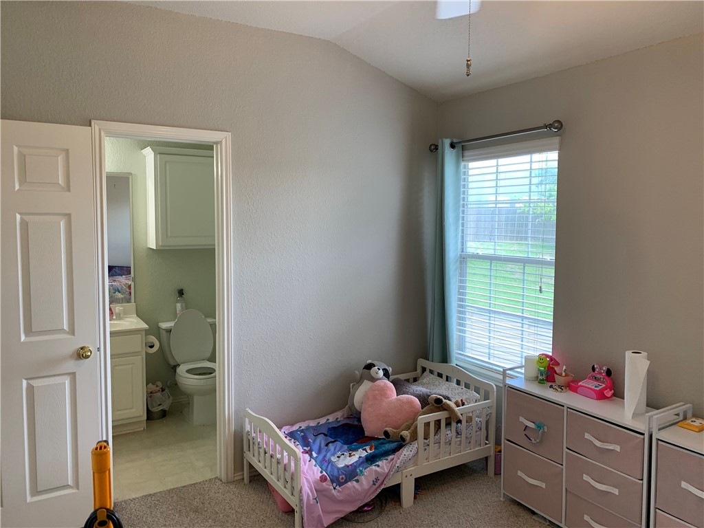 1900 Scofield Ridge Parkway, Unit 1202 Austin, TX 78727 - Photo 9 of 18 Secondary bedroom with ensuite bath