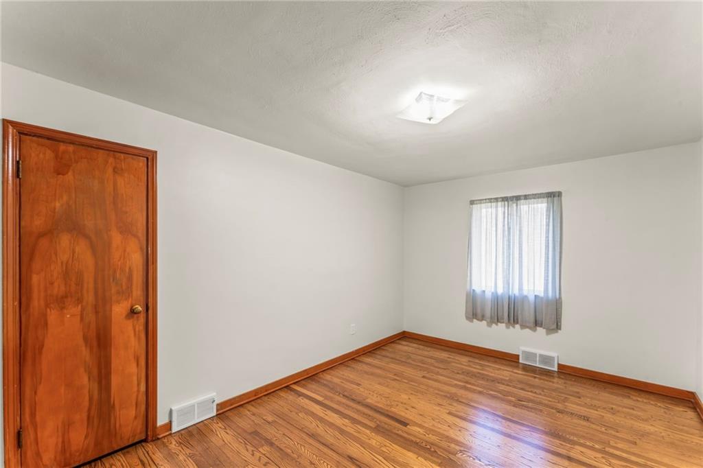 107 Robinson Church Road Bulger, PA 15019 - Photo 15 of 30 an empty room with wooden floor and windows