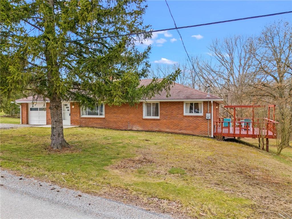 107 Robinson Church Road Bulger, PA 15019 - Photo 2 of 30 a front view of a house with garden