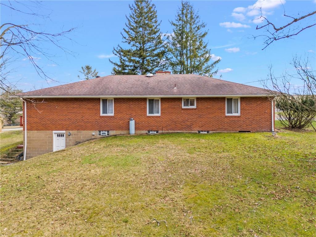 107 Robinson Church Road Bulger, PA 15019 - Photo 22 of 30 a front view of house with yard and trees in the background