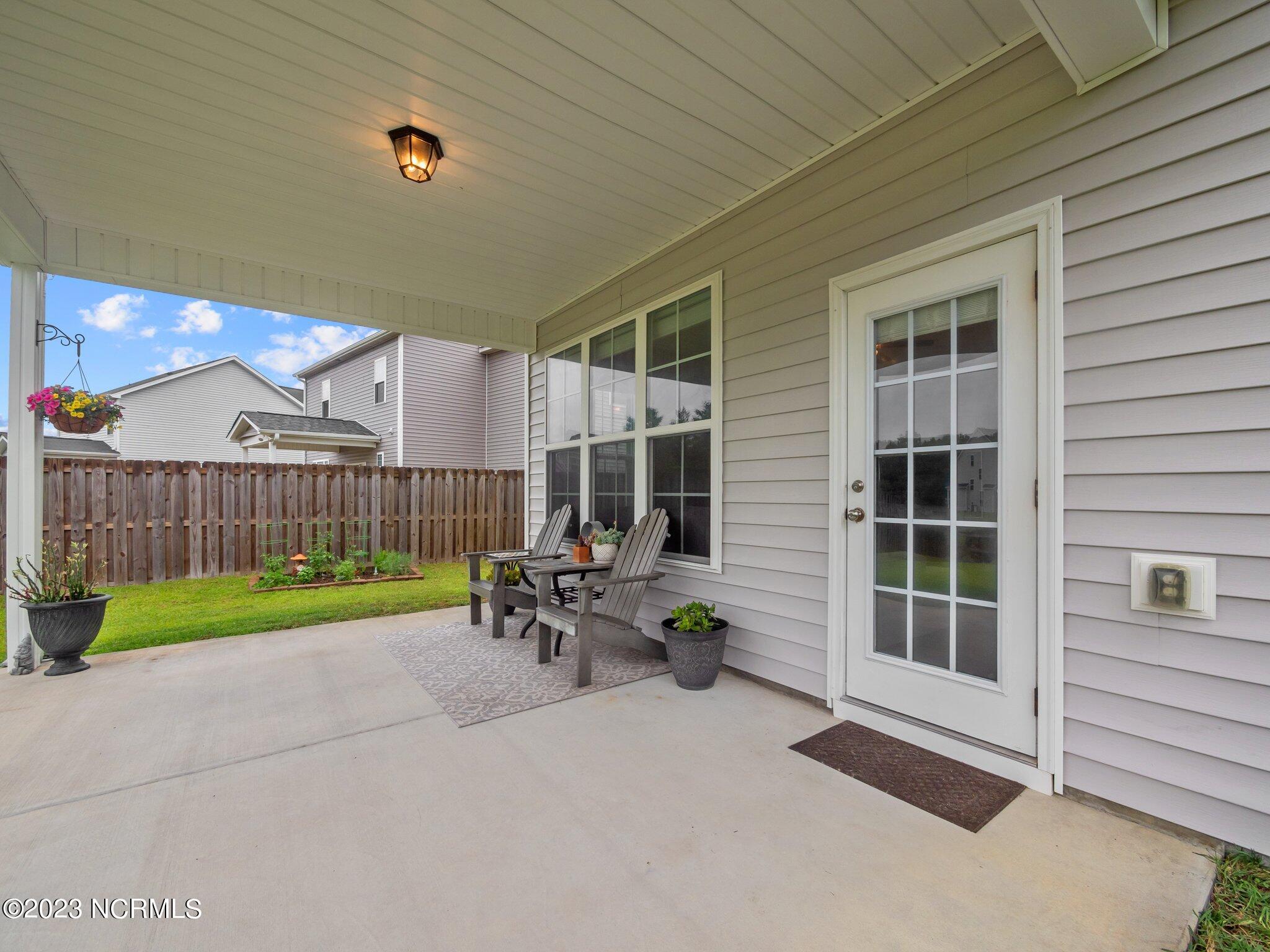 142 Poplar Branch Way Hampstead, NC 28443 - Photo 18 of 58 Back Patio