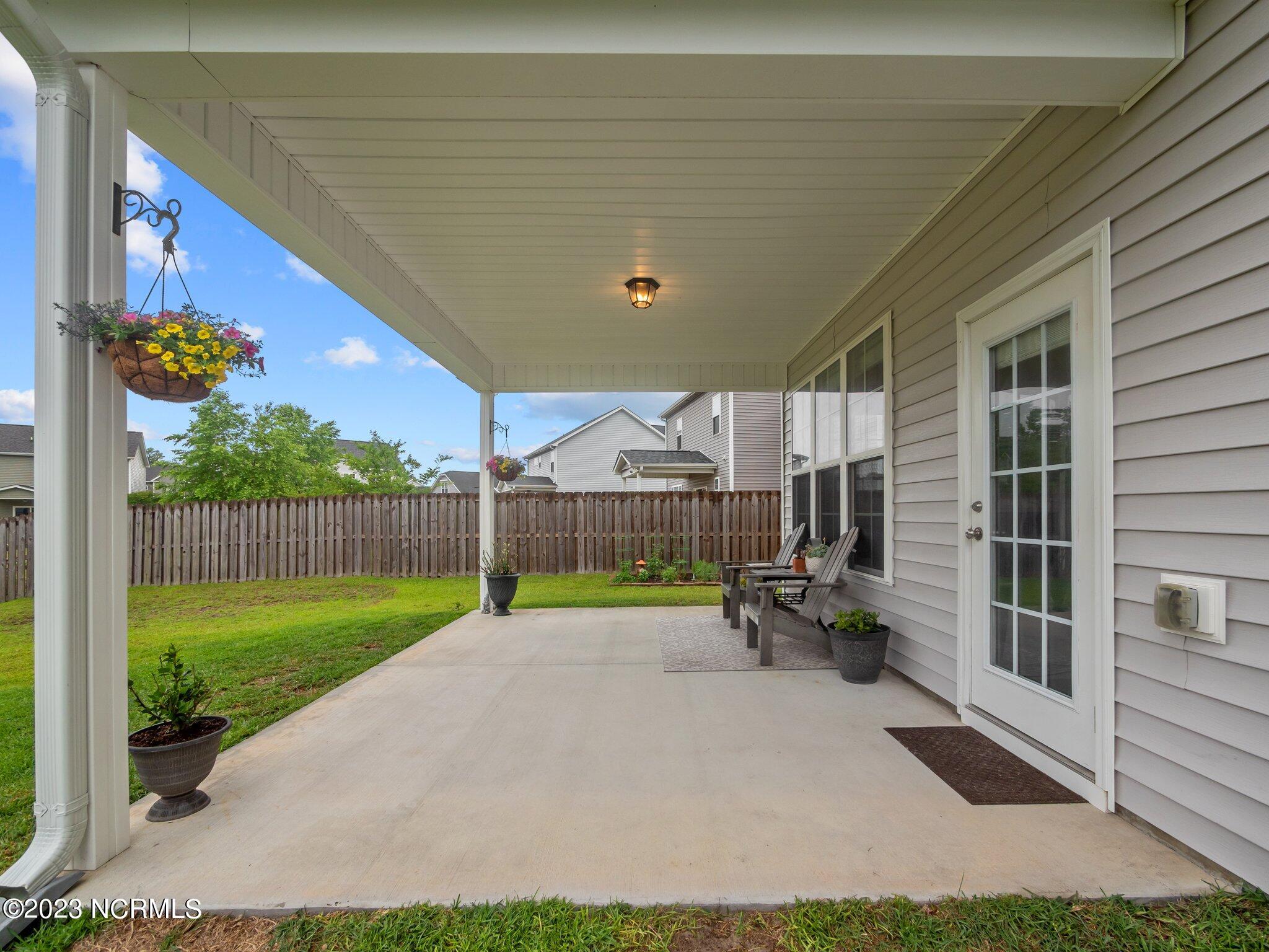 142 Poplar Branch Way Hampstead, NC 28443 - Photo 19 of 58 Back Patio
