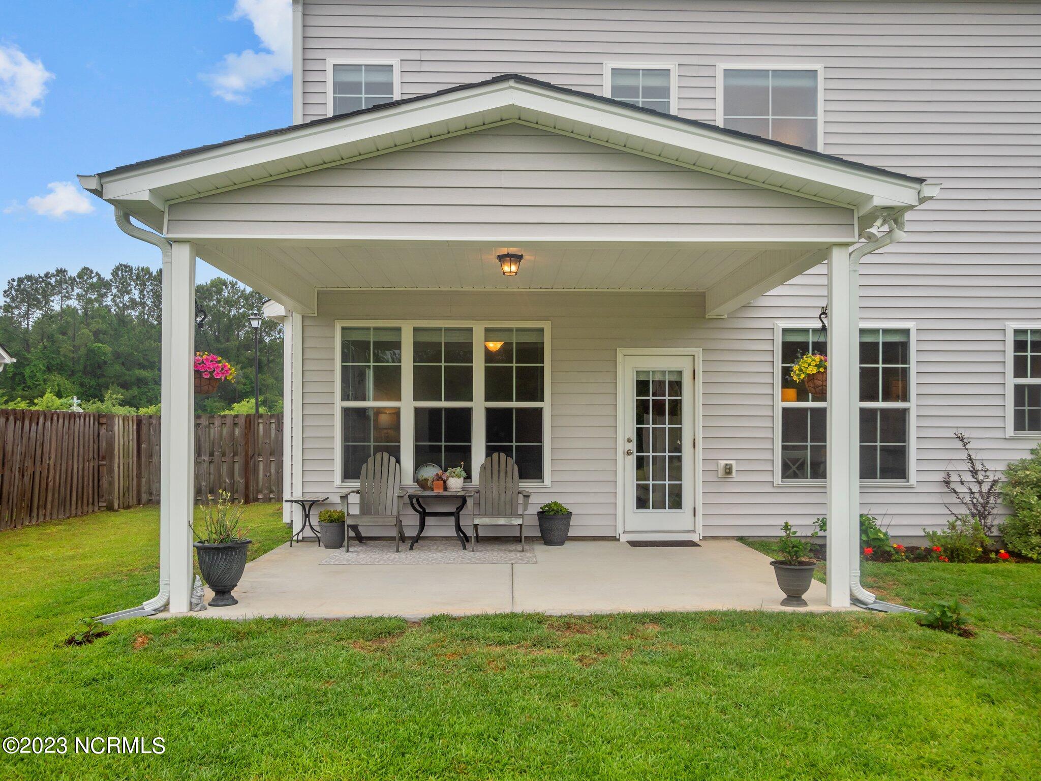 142 Poplar Branch Way Hampstead, NC 28443 - Photo 21 of 58 Back Patio