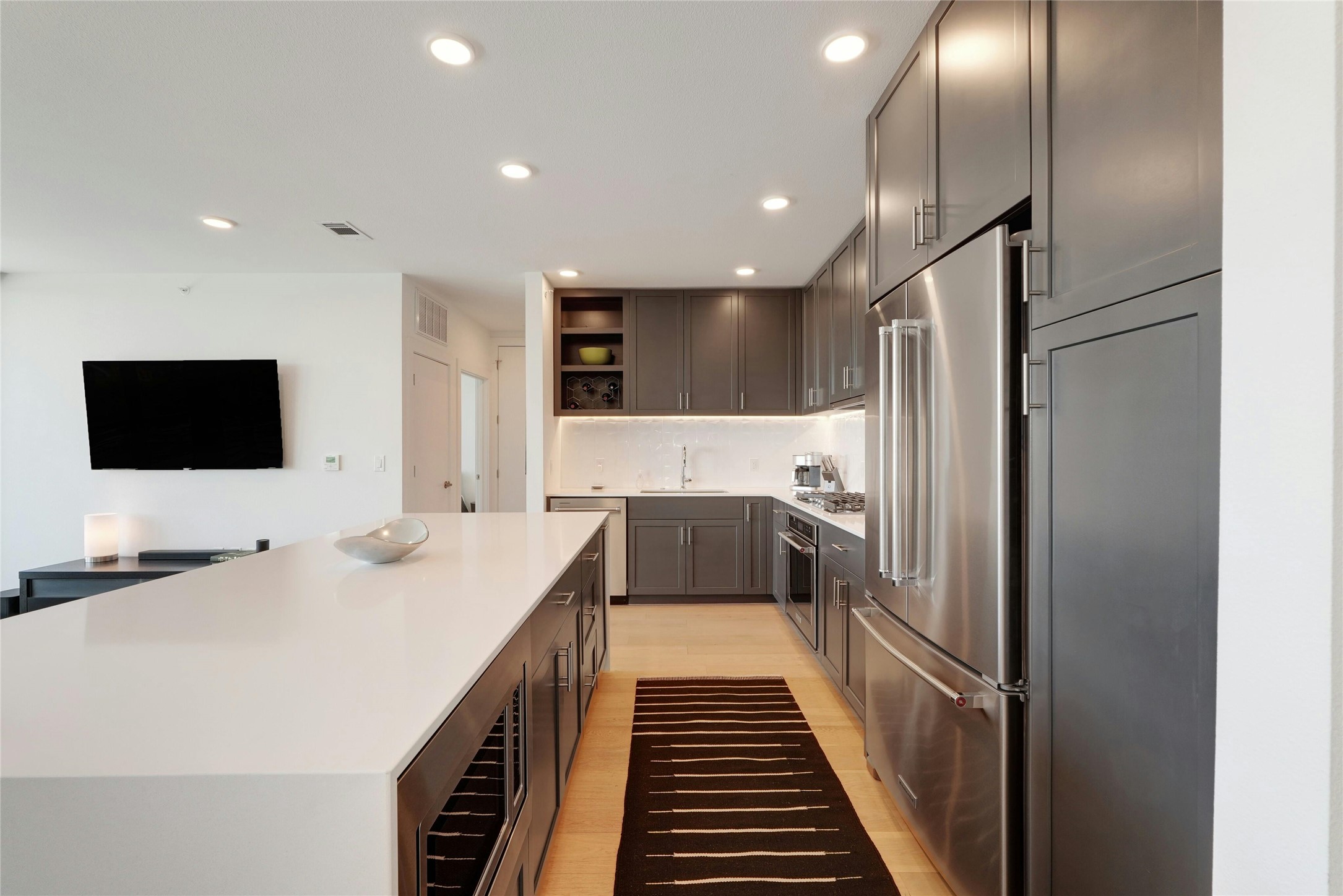 1600 South 1st Street, Unit 403 Austin, TX 78704 - Photo 12 of 33 a kitchen with a sink stainless steel appliances and refrigerator