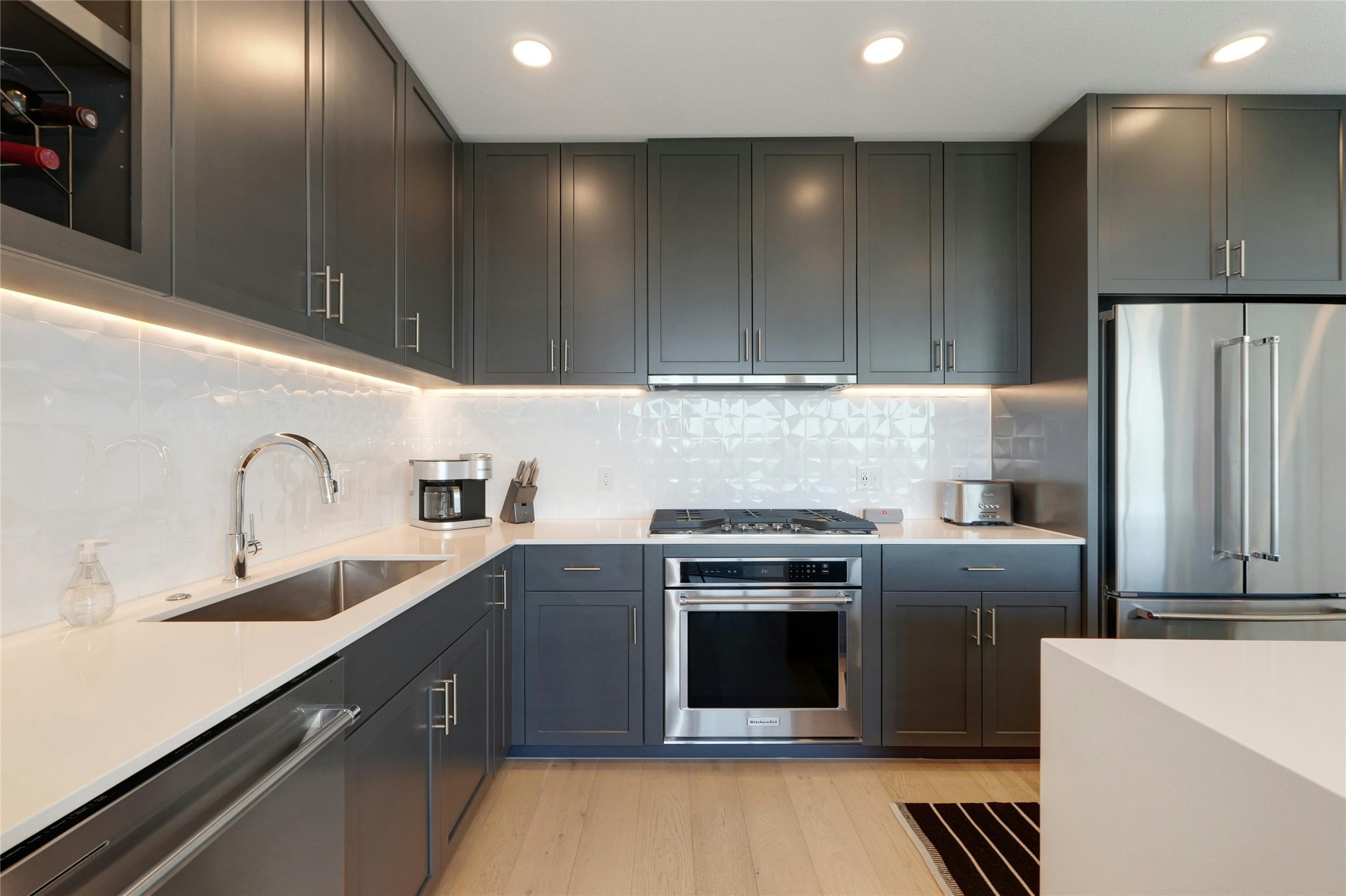 1600 South 1st Street, Unit 403 Austin, TX 78704 - Photo 14 of 33 a kitchen with stainless steel appliances a sink a stove a refrigerator and cabinets