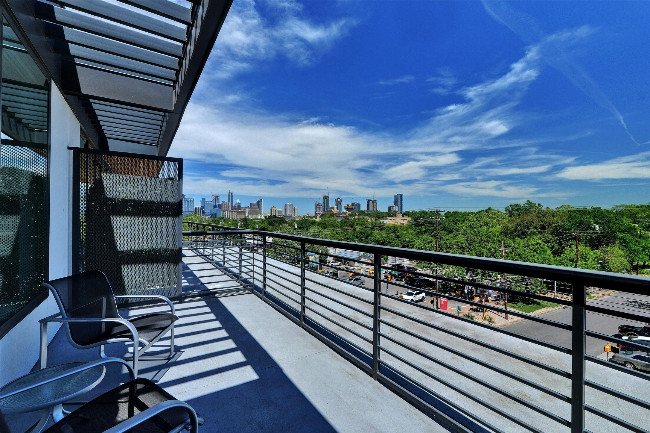 1600 South 1st Street, Unit 403 Austin, TX 78704 - Photo 3 of 33 a view of balcony with wooden floor and city view