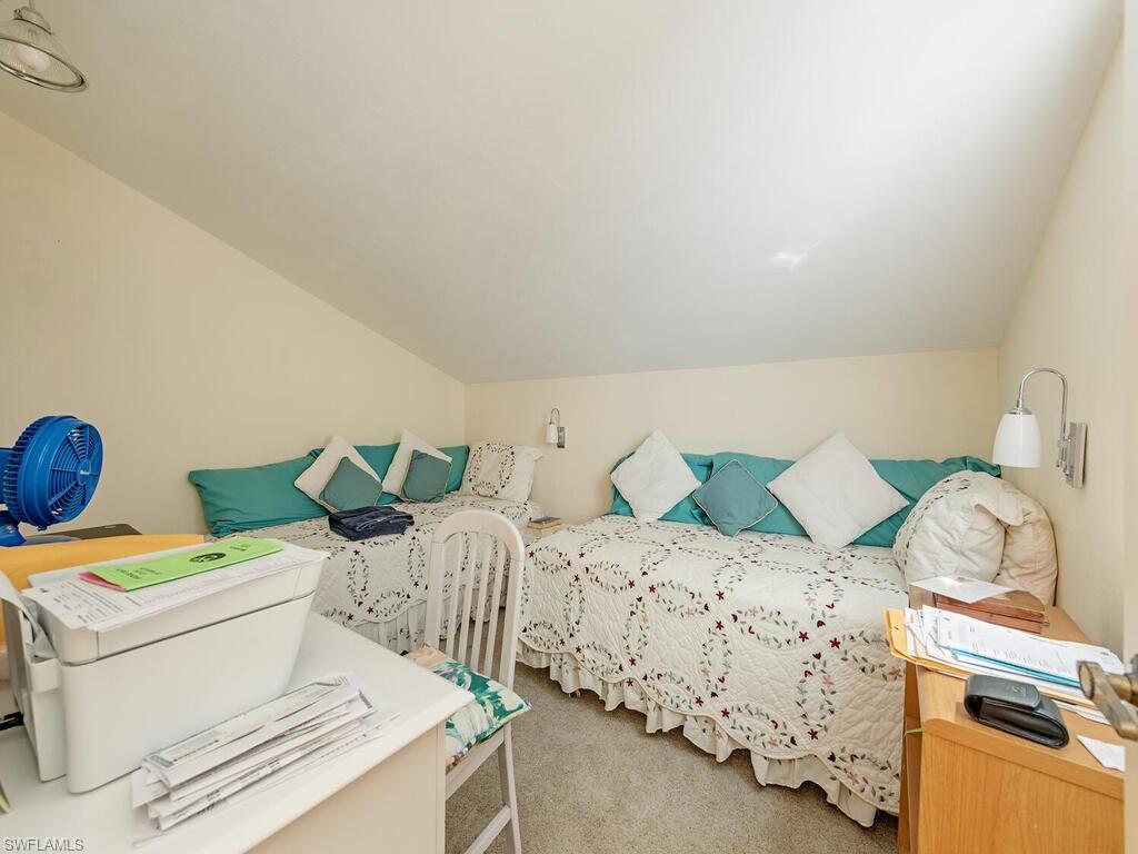 508 Bristle Cone Lane, Unit 55 Naples, FL 34113 - Photo 11 of 19 a bedroom with a bed and a window