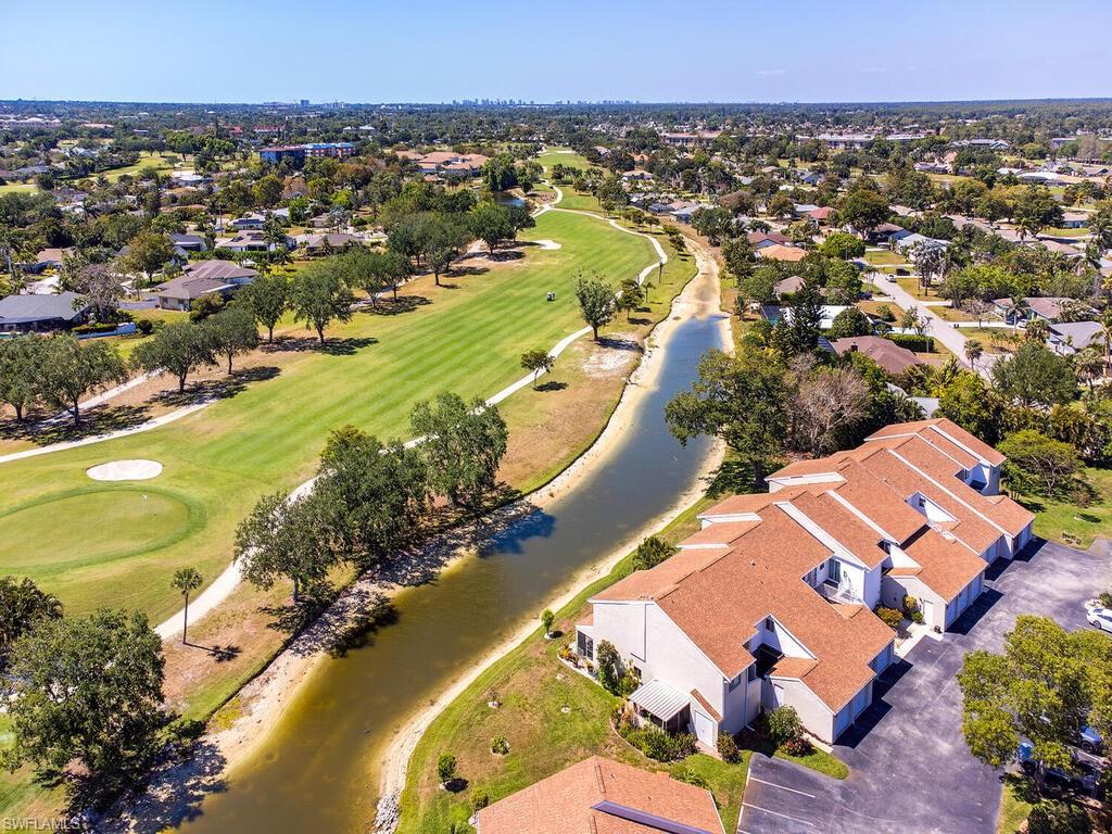 508 Bristle Cone Lane, Unit 55 Naples, FL 34113 - Photo 16 of 19 an aerial view of residential houses with outdoor space