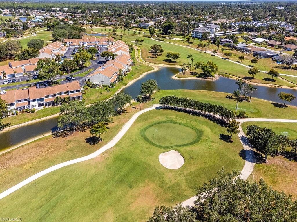508 Bristle Cone Lane, Unit 55 Naples, FL 34113 - Photo 19 of 19 an aerial view of residential houses with outdoor space