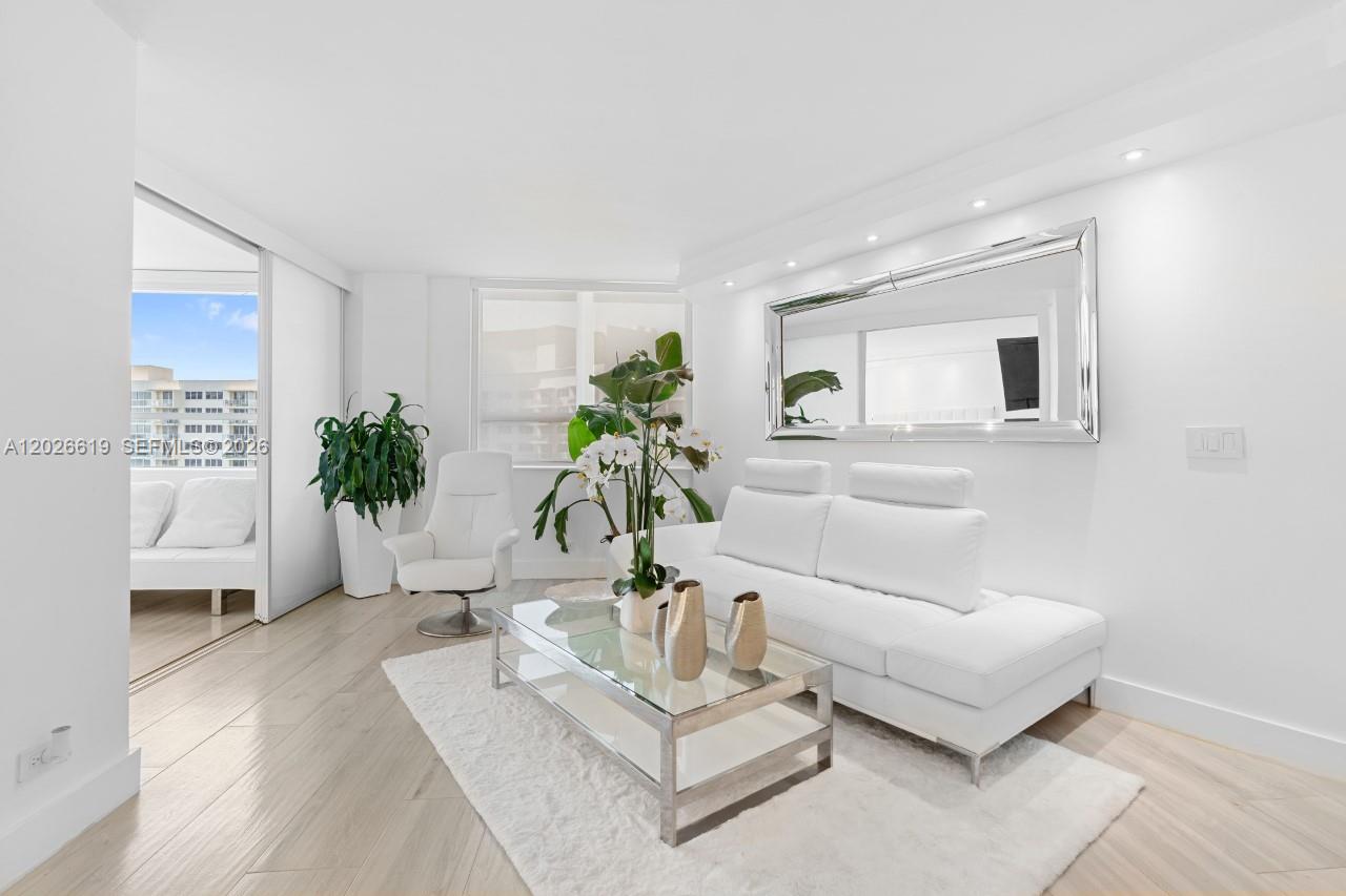 1500 Bay Road, Unit 1268S Miami Beach, FL 33139 - Photo 13 of 31 a living room with furniture potted plant and a window