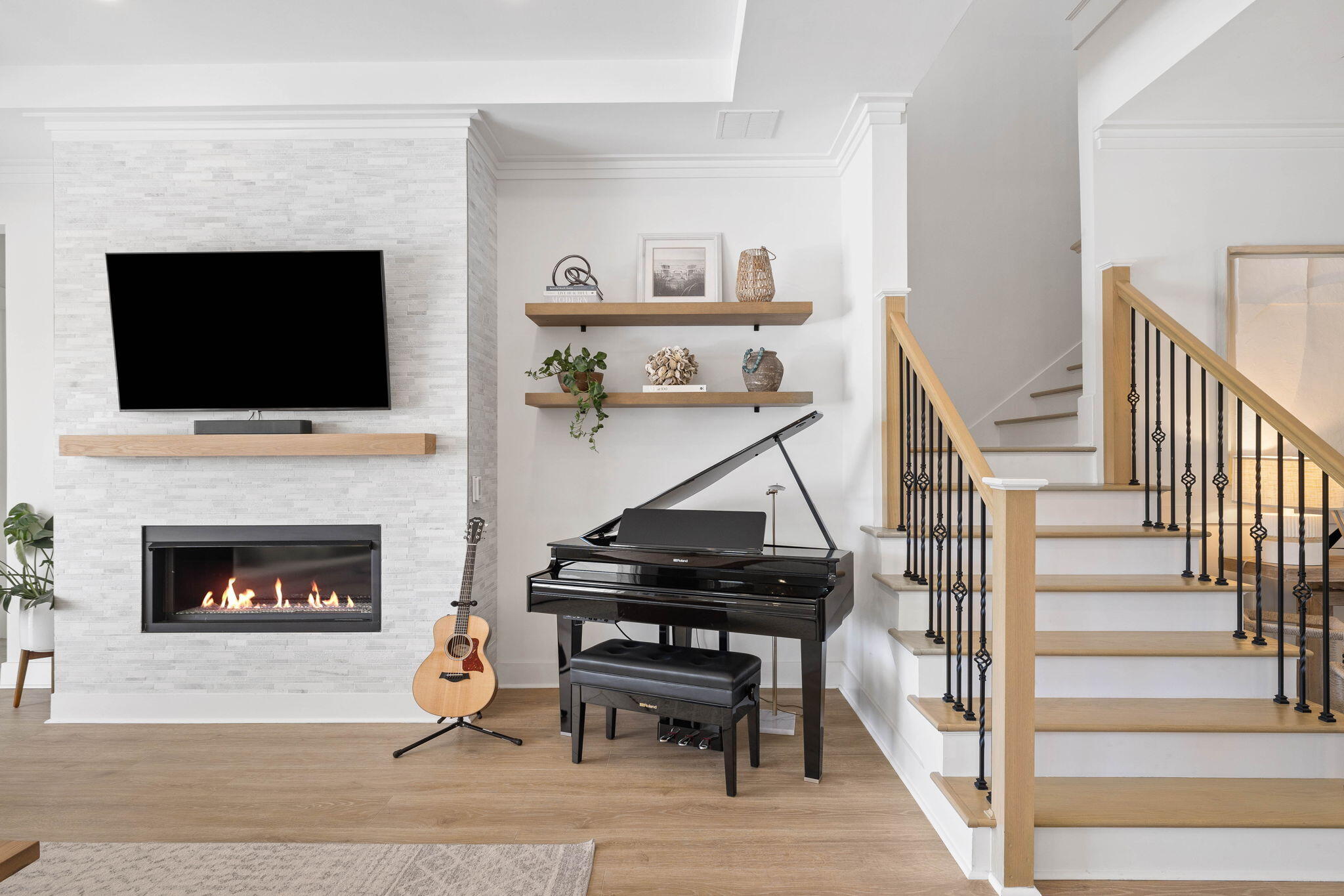 351 Lafayette Road Watersound, FL 32461 - Photo 23 of 90 a living room with a fireplace and a flat screen tv