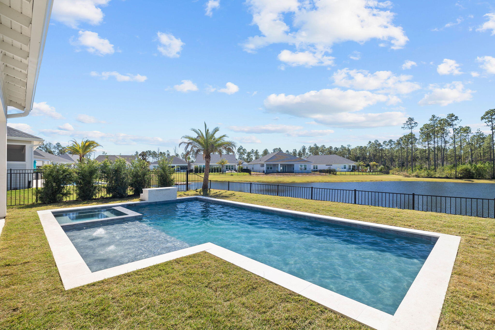 351 Lafayette Road Watersound, FL 32461 - Photo 32 of 90 a view of a swimming pool and lake from nearby houses