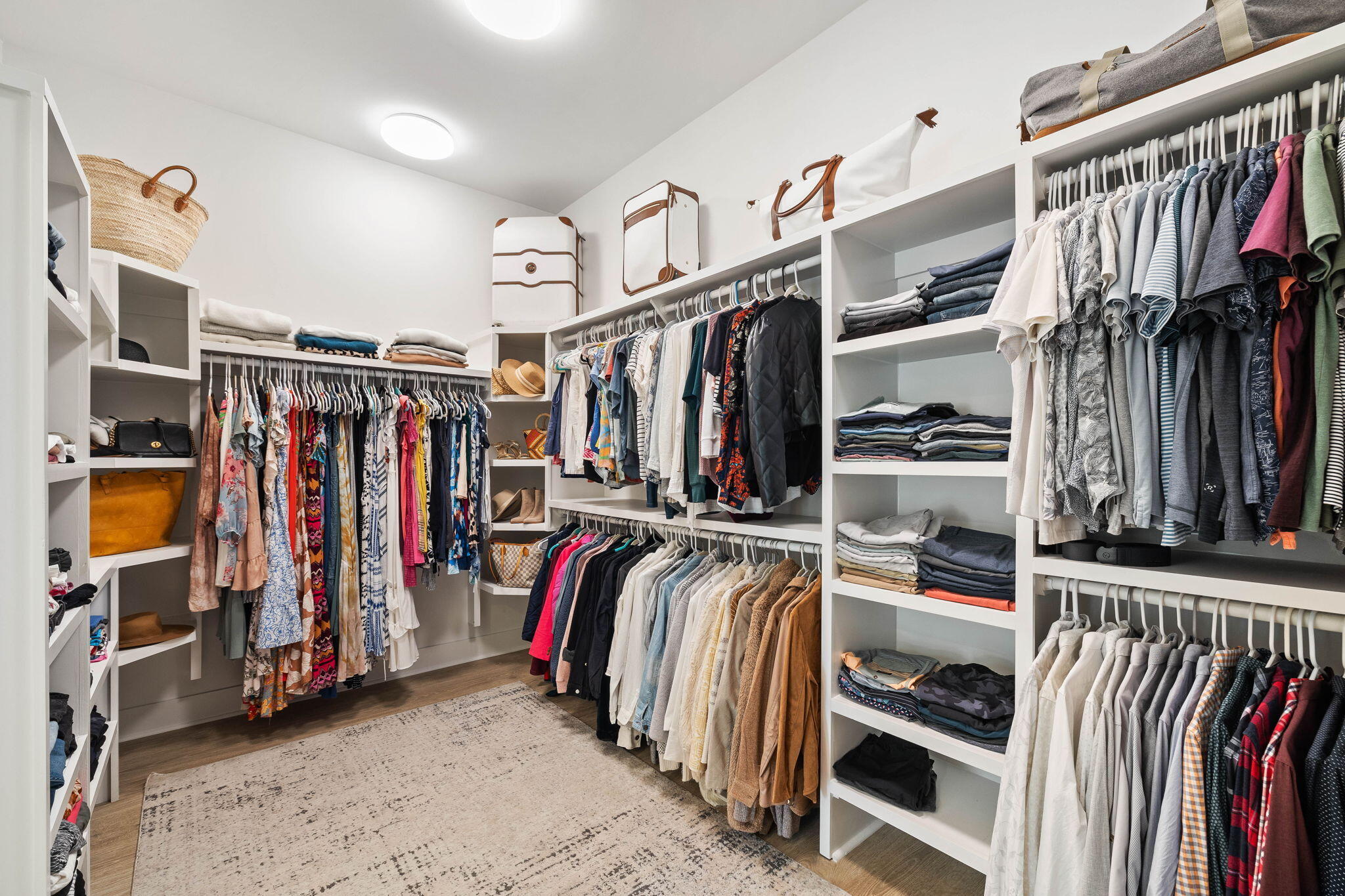 351 Lafayette Road Watersound, FL 32461 - Photo 44 of 90 a view of walk in closet with clothes and shoes