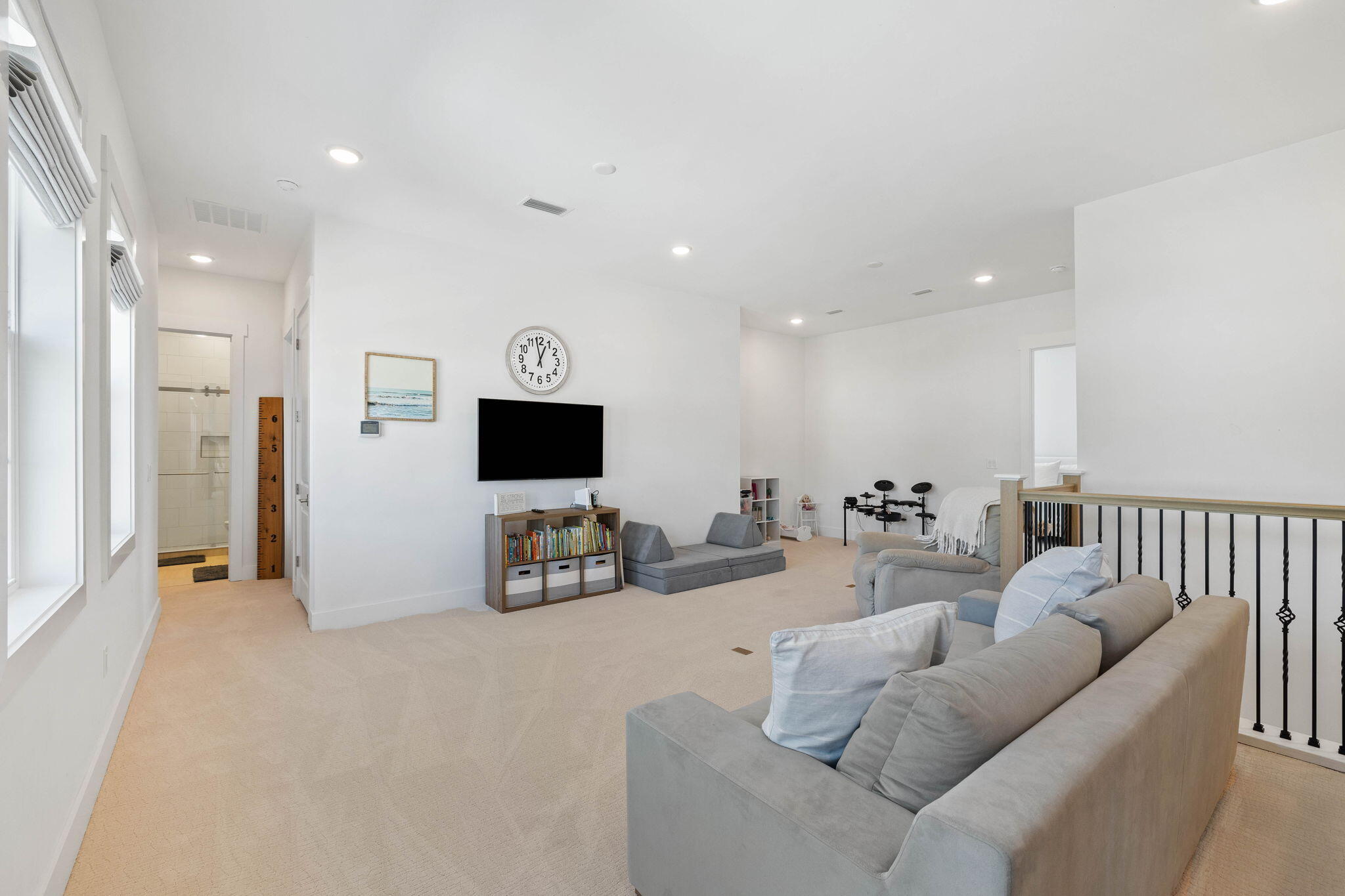 351 Lafayette Road Watersound, FL 32461 - Photo 56 of 90 a living room with furniture and a flat screen tv