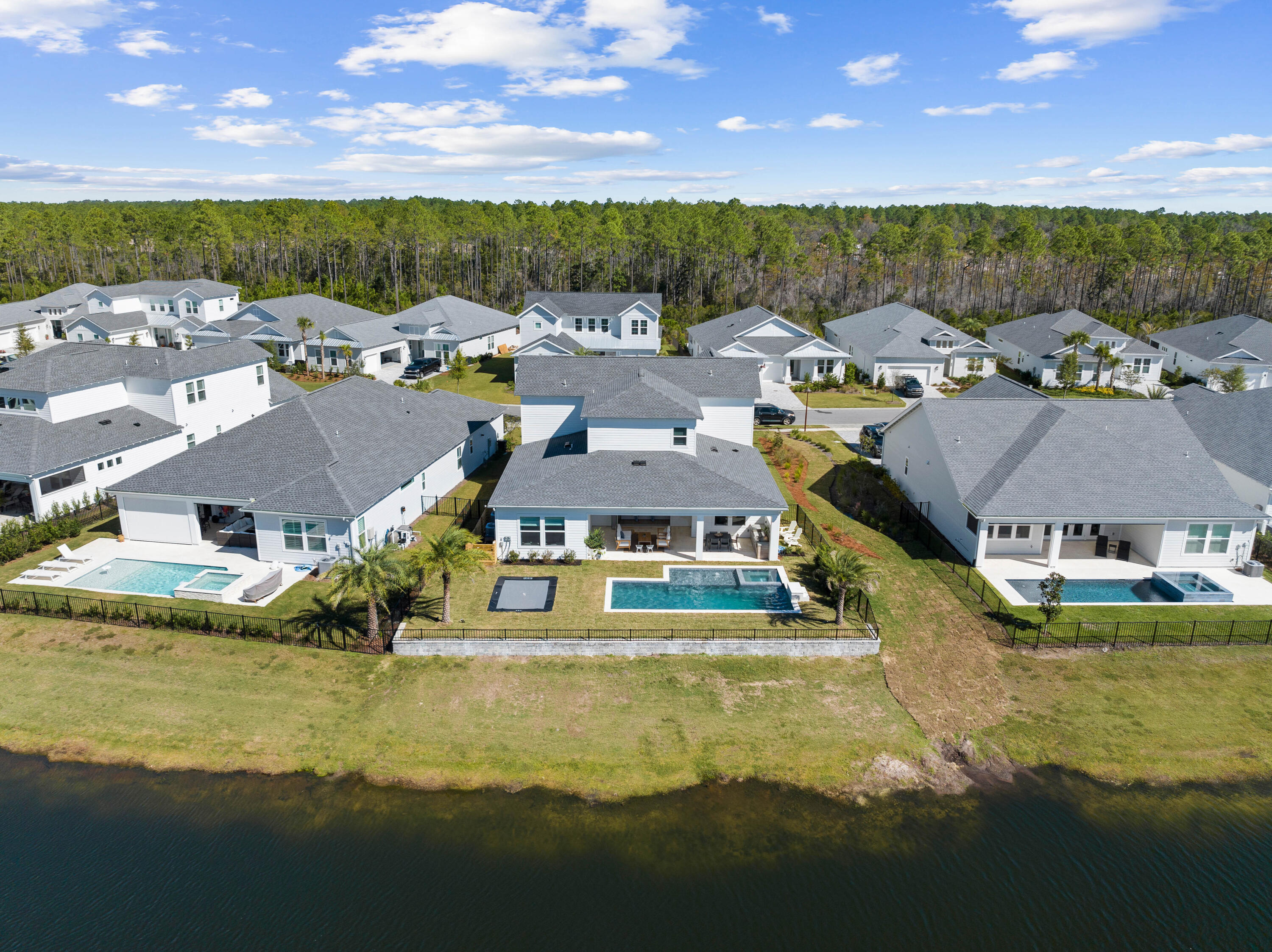 351 Lafayette Road Watersound, FL 32461 - Photo 7 of 90 a view of a town with swimming pool and lawn chairs