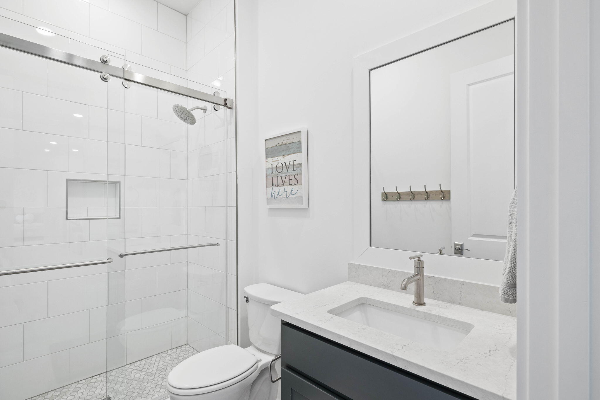 351 Lafayette Road Watersound, FL 32461 - Photo 72 of 90 a bathroom with a sink toilet and shower