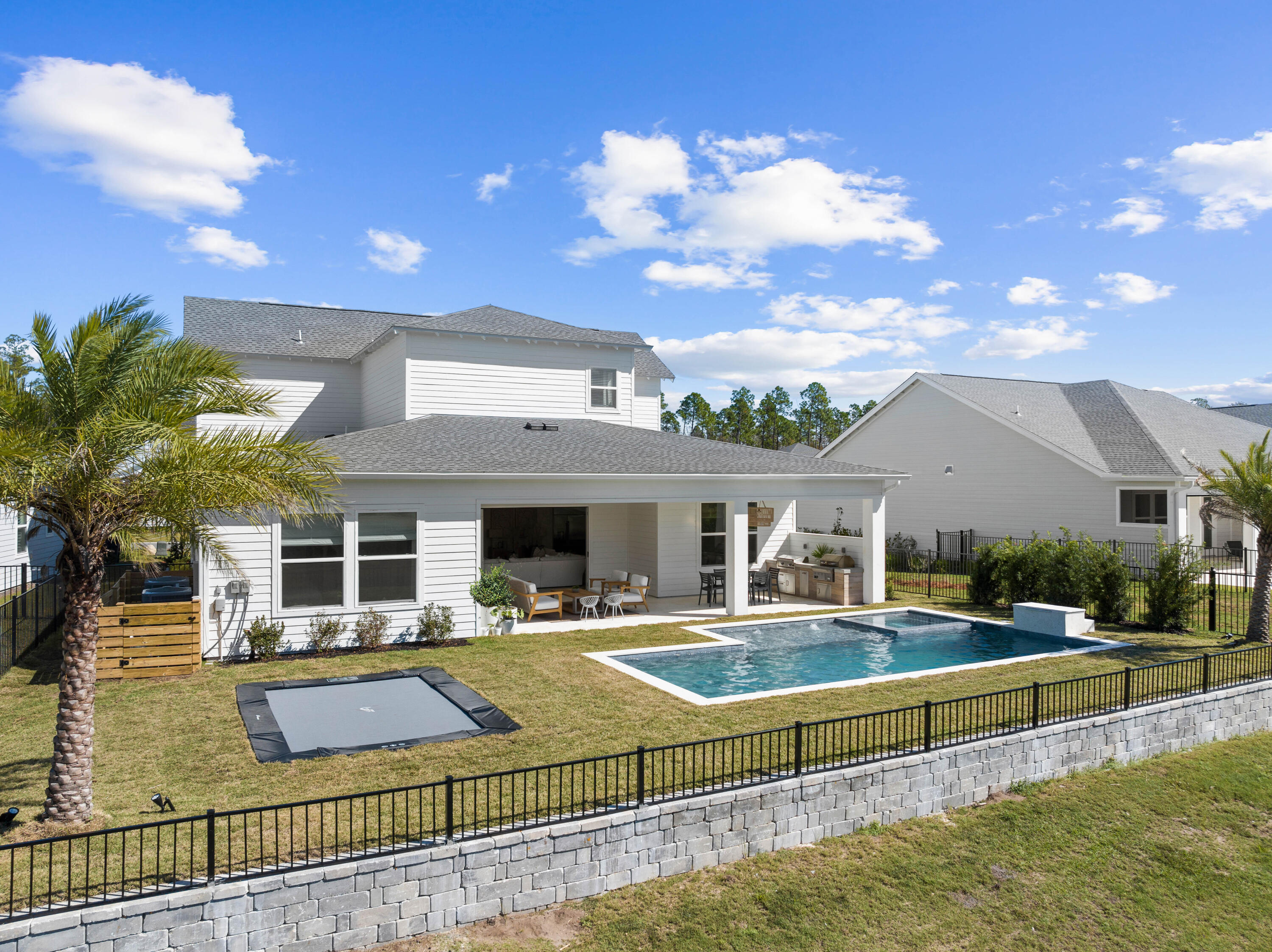 351 Lafayette Road Watersound, FL 32461 - Photo 10 of 90 a view of a house with swimming pool and chairs